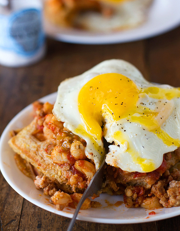 Chili and cornbread waffle stacks with an egg on top